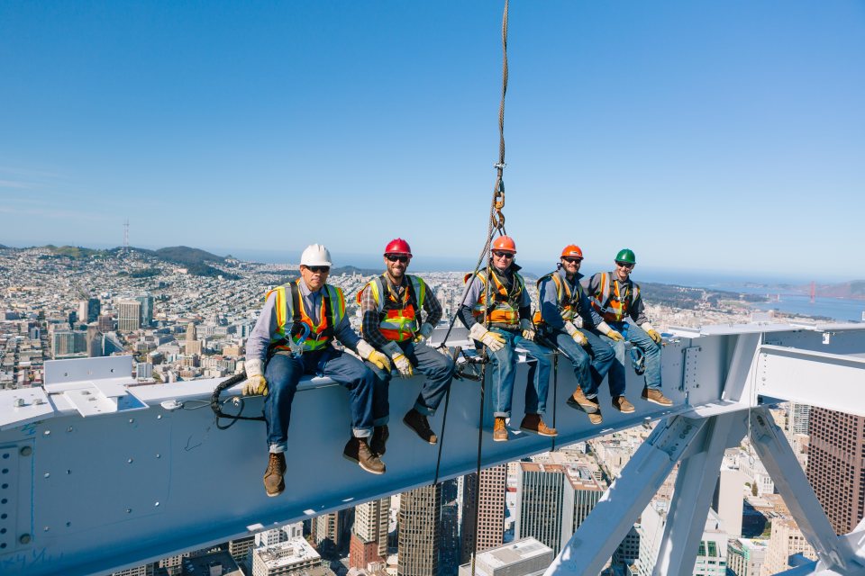 Five Herrick ironworkers seated on a steel beam